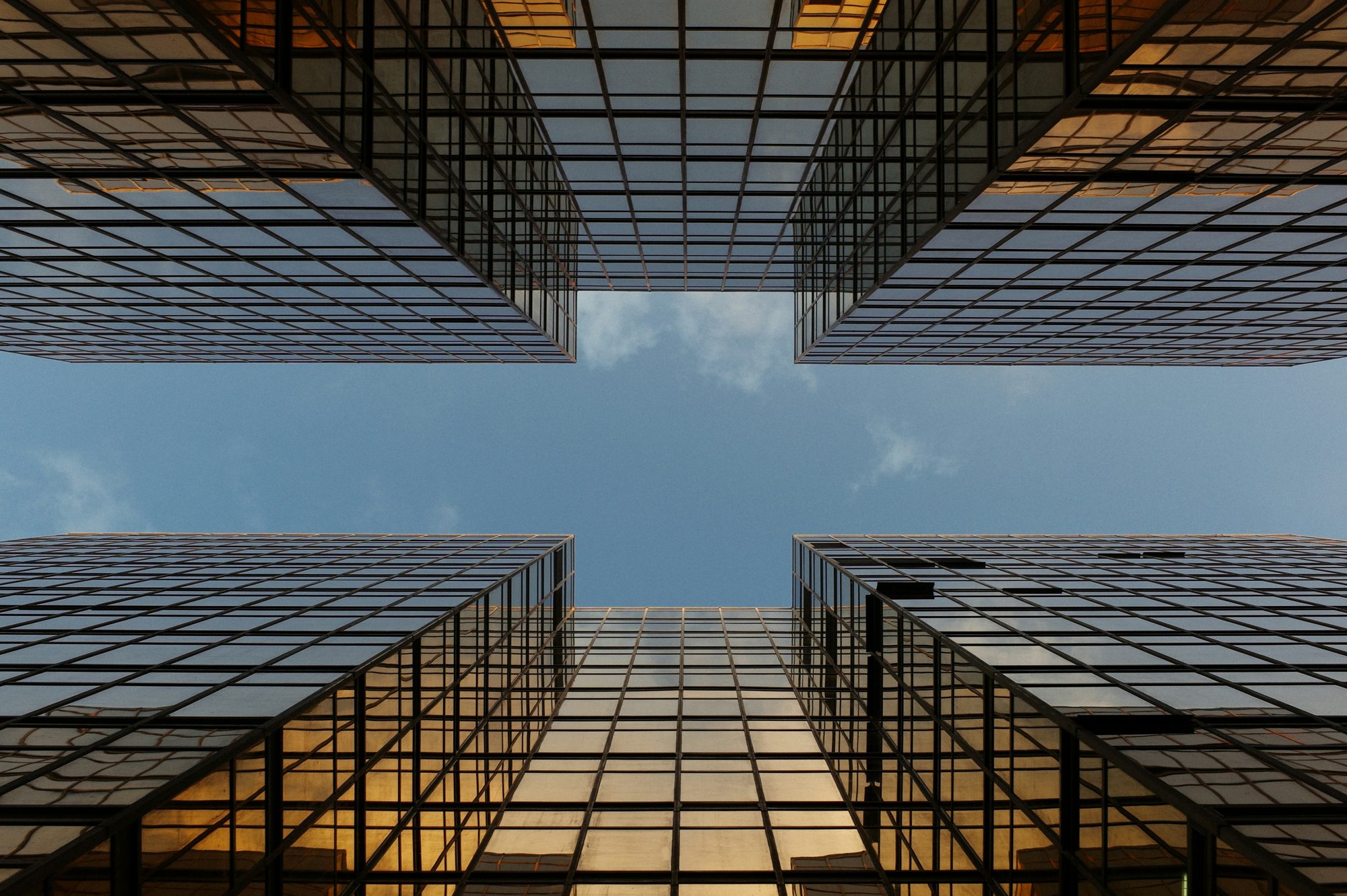 Skyscrapers viewed from below, symbolizing scale and structure